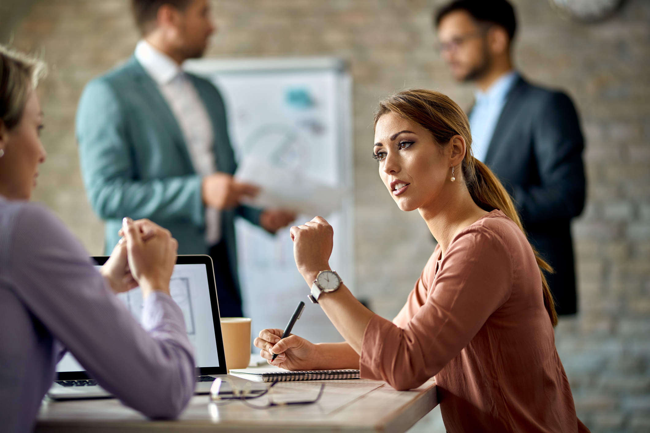 Two businesswomen communicating on a meeting in the office.